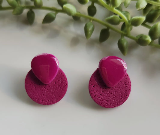 Handmade polymer clay earrings! Beautiful fuchsia color meant to be bold and stand out! These earrings are designed with fuchsia clay mix, with a matte cicle and a rounded upside down glossy triangle. Medium size studs approximately 1" long.