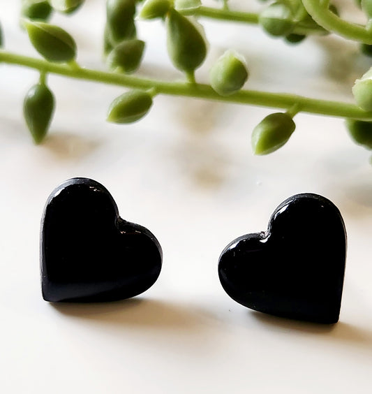 Handmade Polymer Clay Earrings! Featuring a beautiful black heart pair of studs.  Lightweight and with resin for a glossy look. Approximately 1/2" long.