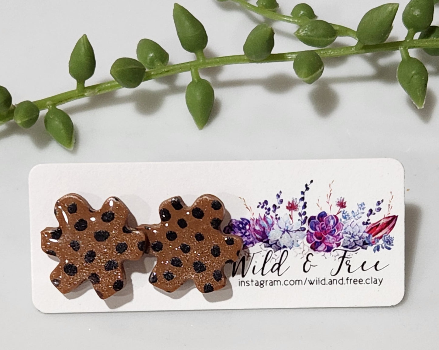 Handmade polymer clay earrings! Floral shape stud with brown background clay and balck polka dot paint. These stud earrings are perfect for any outfit and a staple accessory item for all. Studs are approximately .5" long and with resin for a glossy look.