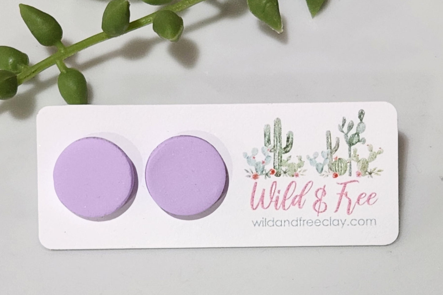 Handmade polymer clay earrings! These earring studs are a beautiful lavendar clay color with a circle shape. They are perfectly sized and match with any outfit. Earring studs are lightweight, matte look and approximately .5" long.