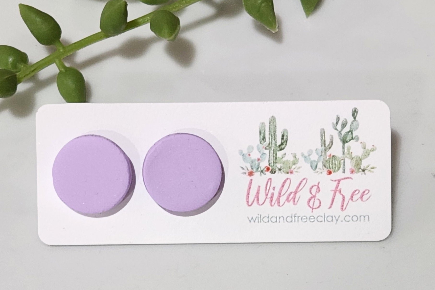 Handmade polymer clay earrings! These earring studs are a beautiful lavendar clay color with a circle shape. They are perfectly sized and match with any outfit. Earring studs are lightweight, matte look and approximately .5" long.