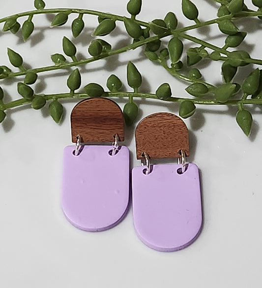 Handmade polymer clay earrings! These earrings are a beautiful lavendar color shaped as closed u-letter. A wood circular stud completes this simple yet stunning earring. Earrings are lightweight, matte and approximately 2" long.