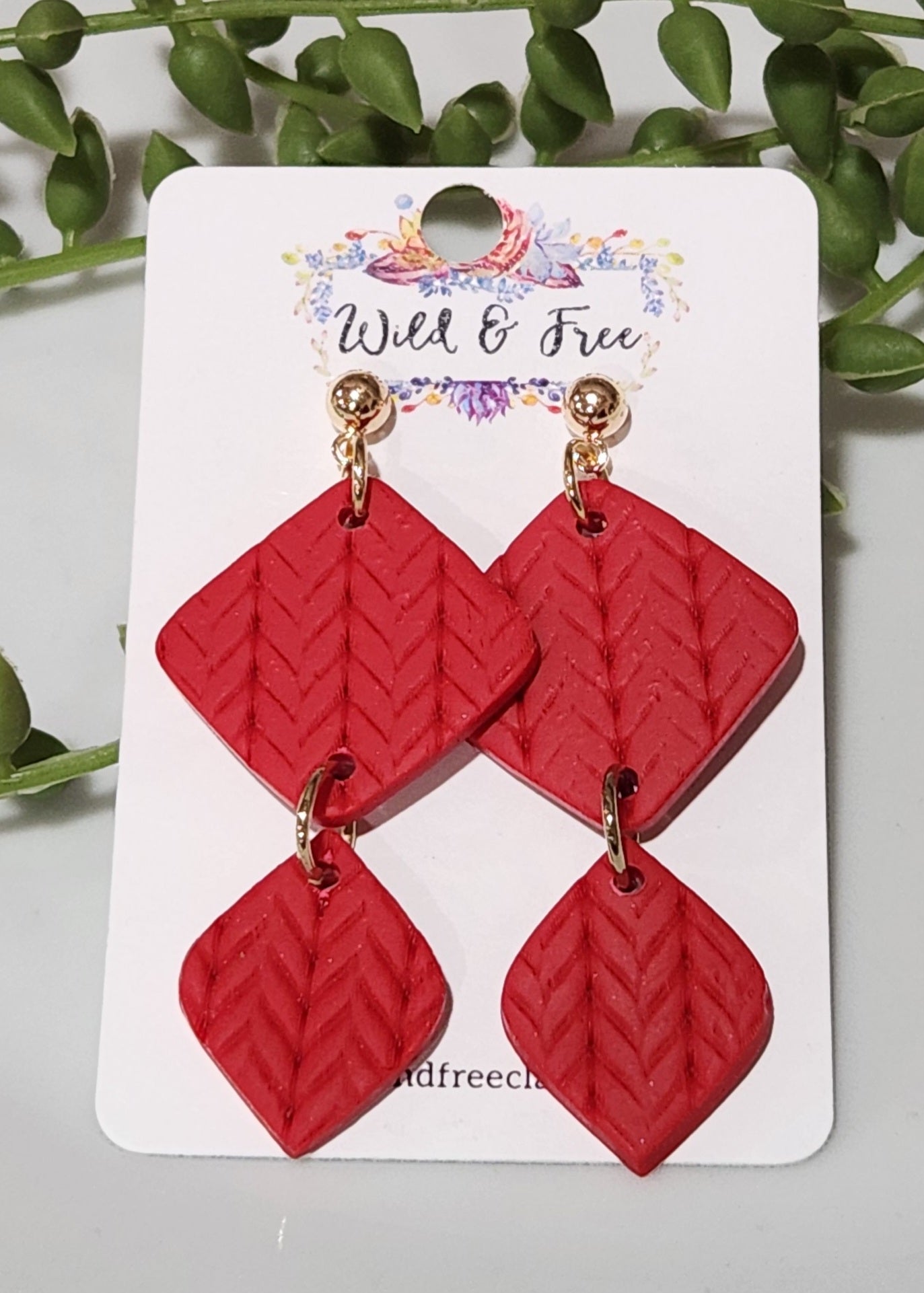 Handmade polymer clay earrings! These beautiful red clay color earrings consist of a gold plated circle stud and two diamond textured clay pieces. Perfect for any season, lightweight and approximately 2" long.