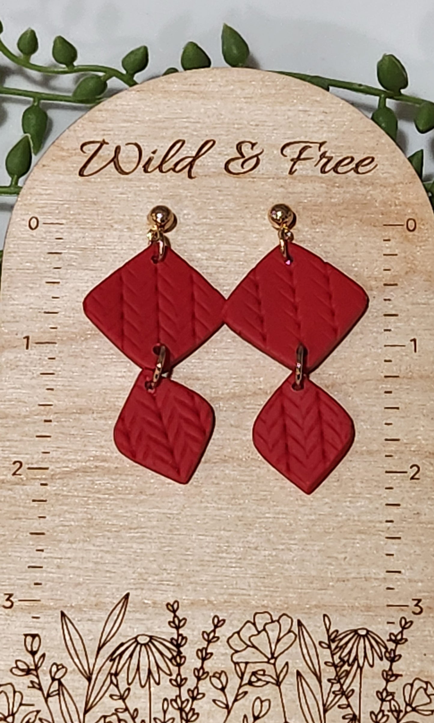 Handmade polymer clay earrings! These beautiful red clay color earrings consist of a gold plated circle stud and two diamond textured clay pieces. Perfect for any season, lightweight and approximately 2" long.