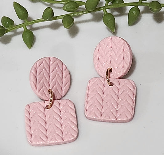 Handmade polymer clay earrings! These clay earrings consist of a circle with a square shaped dangle.  It's beautiful soft pink color is textured throughout with lines and arrows. These dangle earrings are perfect for any outfit and a staple accessory item for all. Earrings are approximately 1.5" long and with a matte look.