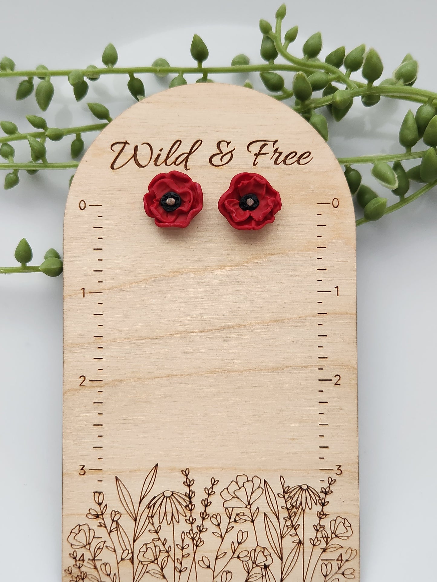 Handmade polymer clay earrings! These beautiful studs are made from red clay in a poppy flower design. They are a unique and perfect touch to any outfit. Lightweight, matte, and approximately .5" long.