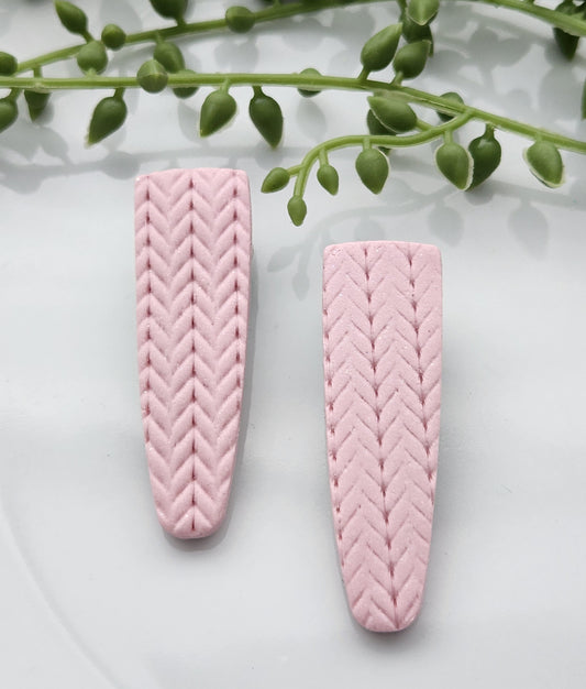 Handmade polymer clay hair clips! Super lightweight clips that bring a pop to any outfit! This beautiful clip is handmade with polymer clay in a blush pink color. It is matte and textured in a knit woven fabric look. Approximately 2.5" long.