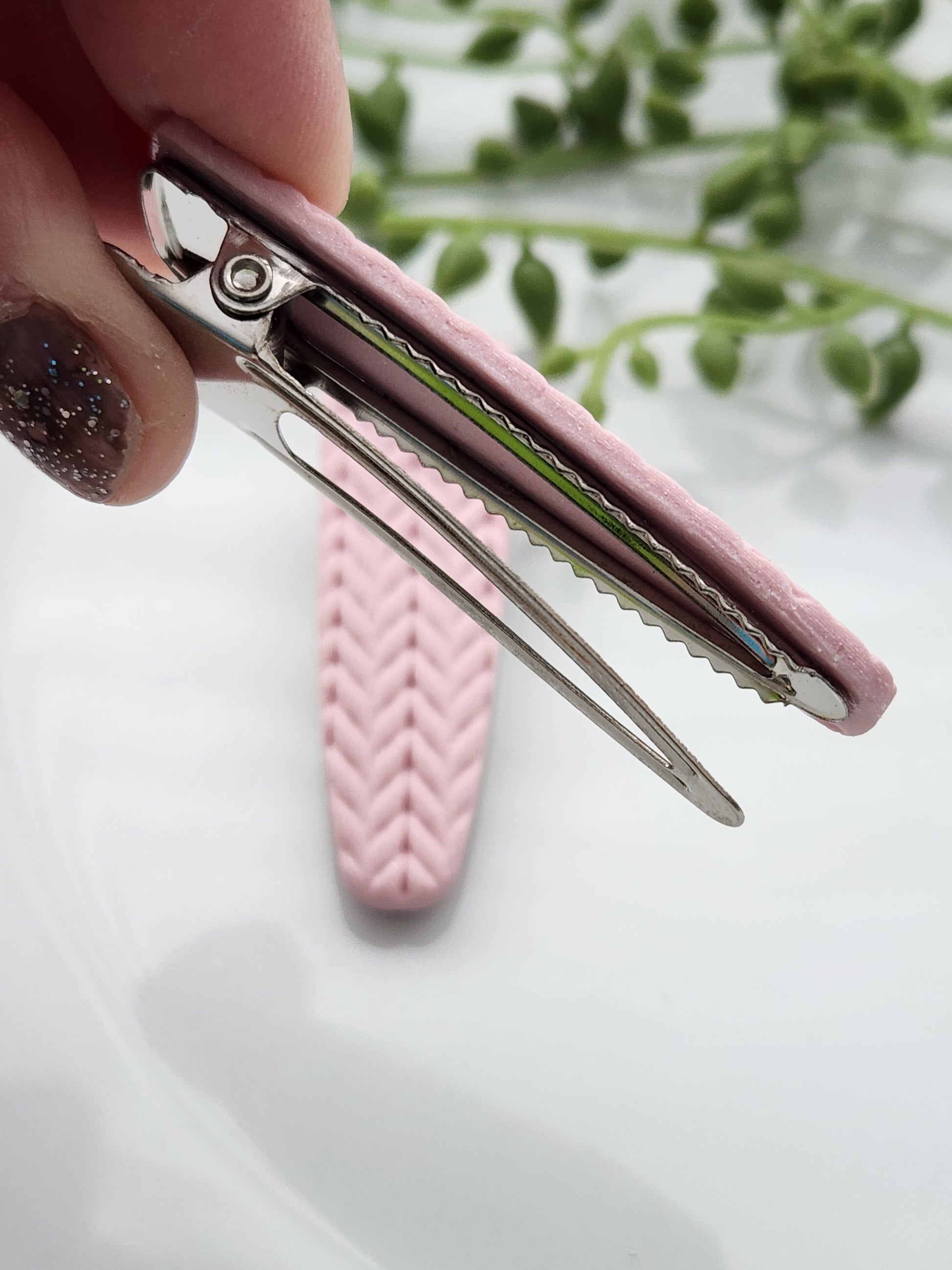 Handmade polymer clay hair clips! Super lightweight clips that bring a pop to any outfit! This beautiful clip is handmade with polymer clay in a blush pink color. It is matte and textured in a knit woven fabric look. Approximately 2.5" long.