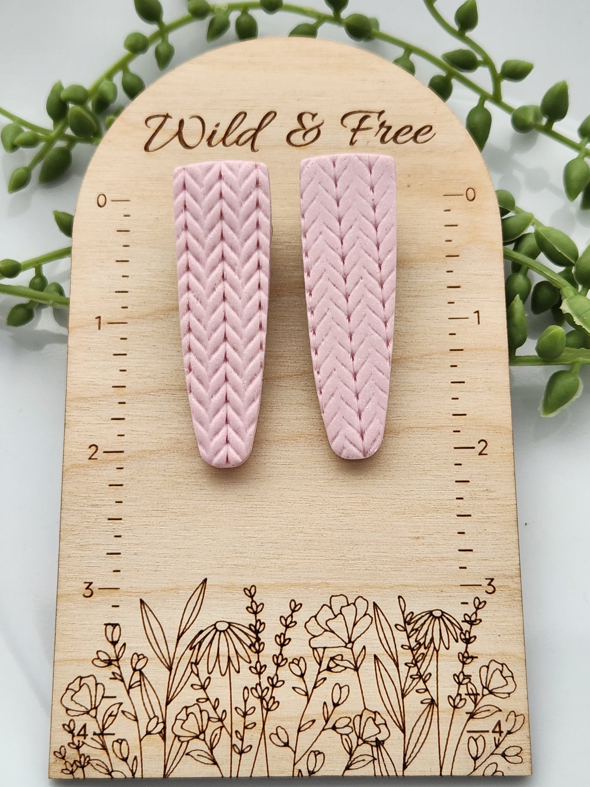 Handmade polymer clay hair clips! Super lightweight clips that bring a pop to any outfit! This beautiful clip is handmade with polymer clay in a blush pink color. It is matte and textured in a knit woven fabric look. Approximately 2.5" long.