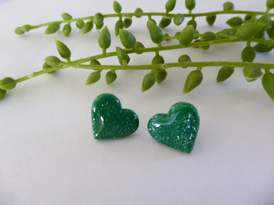 Handmade Polymer Clay Earrings! Featuring a beautiful green heart pair of studs.  Lightweight, full of shimmer and with resin for a glossy look. Approximately 1/2" long.