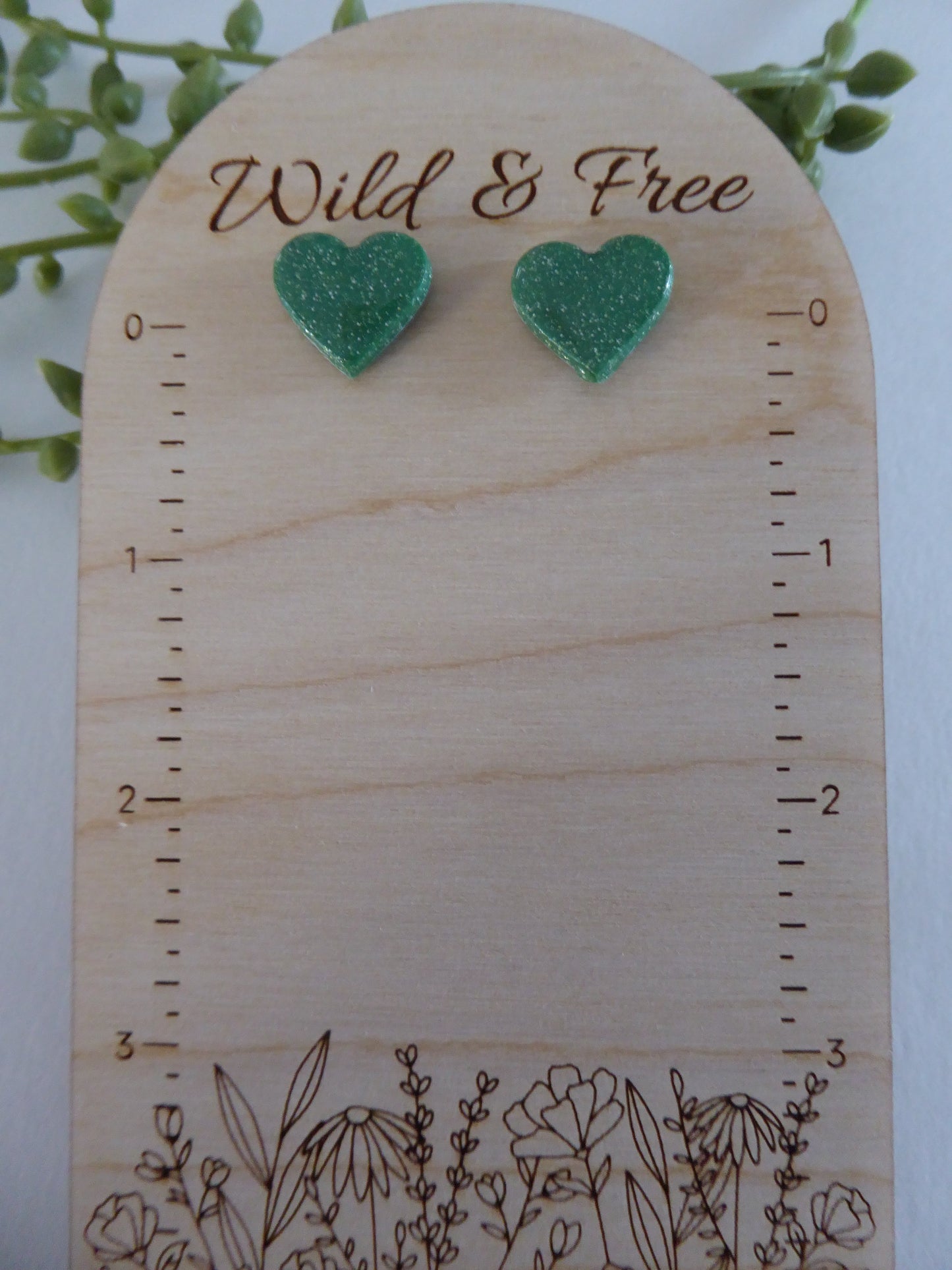 Handmade Polymer Clay Earrings! Featuring a beautiful green heart pair of studs.  Lightweight, full of shimmer and with resin for a glossy look. Approximately 1/2" long.